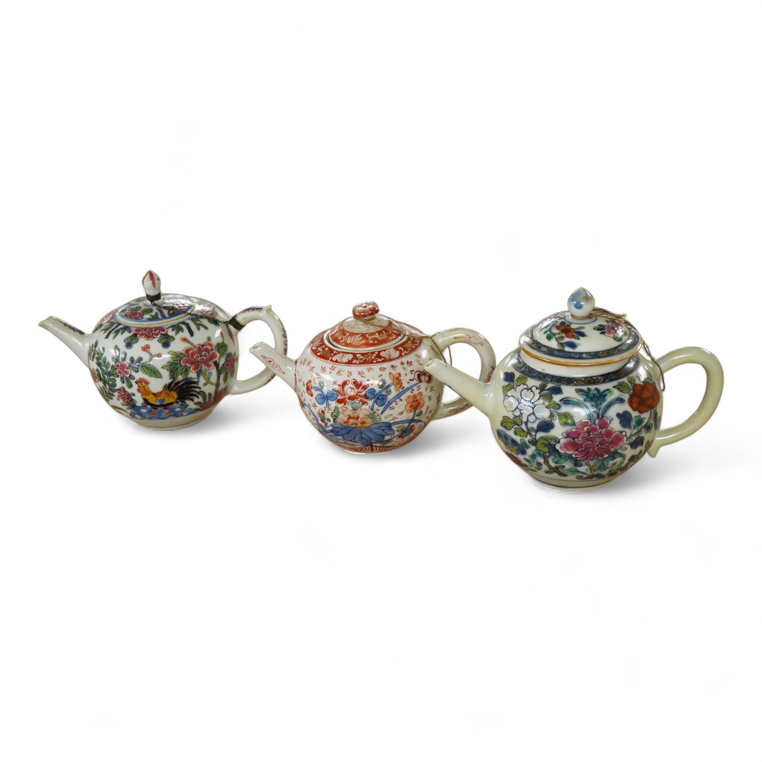 Three 18th century Chinese porcelain European enamelled teapots and covers, tallest - 13cm high